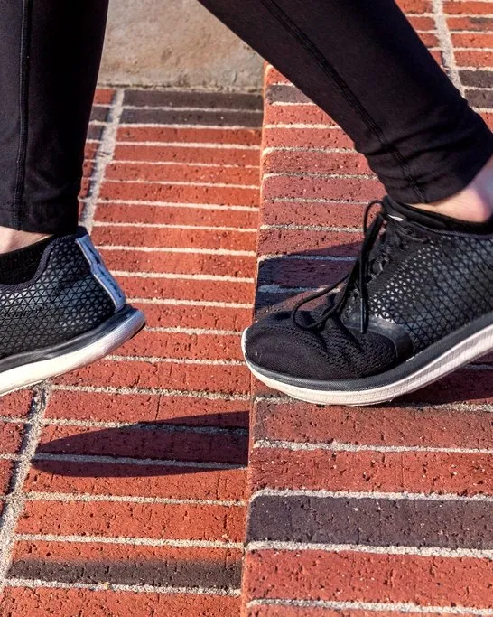 Running shoes on brick steps